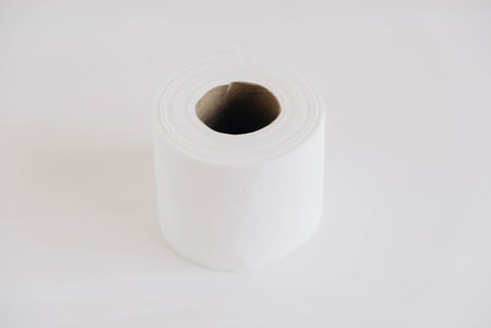 Roll of white toilet paper on a white background.の写真素材