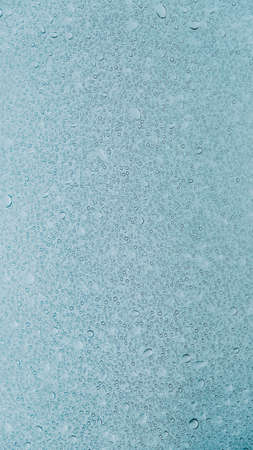 Transparent water drops on a glass background.の写真素材