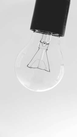 Transparent light bulb on a white background.の写真素材