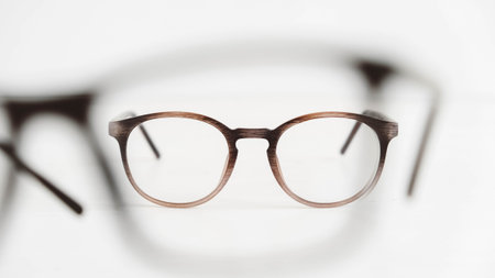 Optical glasses of different shapes on a white background.