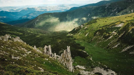 Beautiful mountain landscape of the Carpathians, green mountains and Shpytsi cliffs.の写真素材