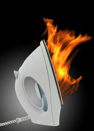 Electric iron in fireの写真素材