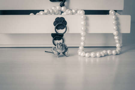 White pearls necklace in wooden casket. Black and whiteの写真素材