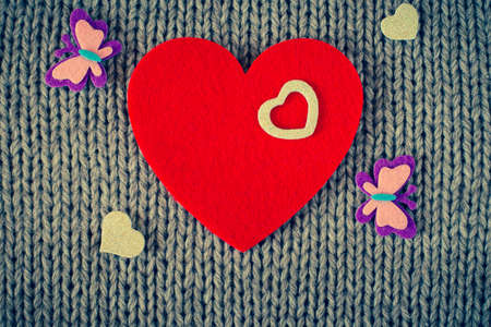 Red felt heart and  colorful decorative  hearts with wool texture in the background. Valentine's  themeの写真素材
