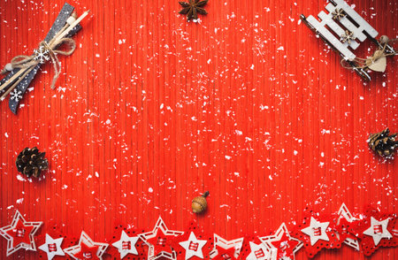 Winter composition with decorative sledge and ski, star anise, acorn, pine cones, colorful felt...