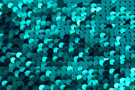 Sequin texture close up. Abstract background. Festive and party concept. Bright shiny backdropの写真素材
