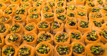 Oriental desserts (baklava) at the market. Food concept background.の写真素材