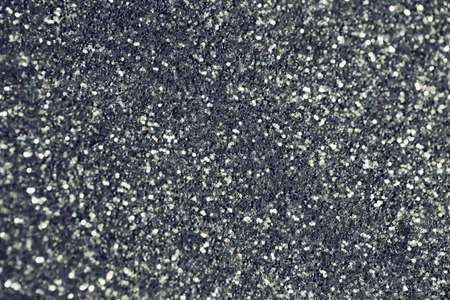 Abstract glittering background. Christmas or birthday backdrop. Party, holiday and festive concept. Invitation card themeの写真素材