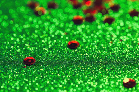 Abstract glittering background with sequins. Christmas or birthday backdrop. Party, holiday and festive concept. Invitation card themeの写真素材