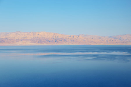 Beautiful view of salty Dead Sea shore with clear water. Ein Bokek, Israel.