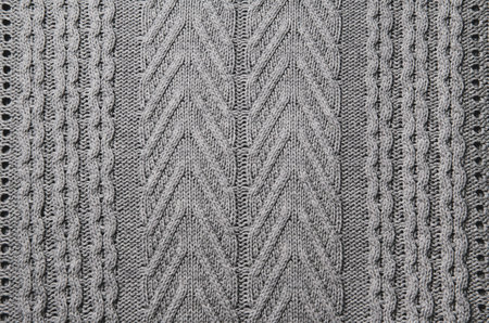 Knitted fabric wool texture close up as a background. Abstract backdrop