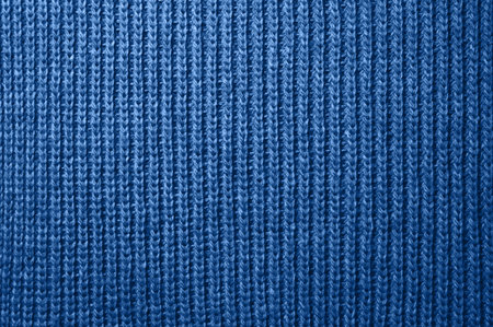 Knitted fabric wool texture close up as a background. Abstract backdrop. Inspired by color of 2020 blueの写真素材