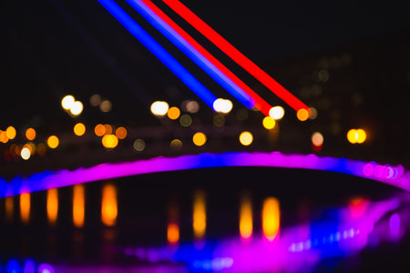 Abstract defocused background of colorful city lights at night. Blurry backdrop