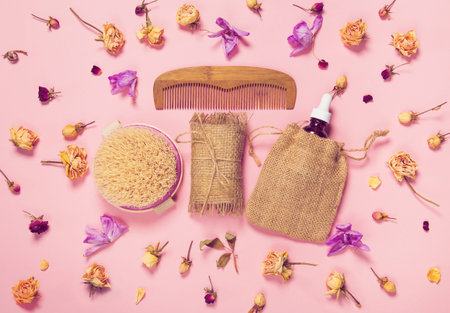 Set of natural soap, aroma oil, wooden comb  and body massage brush with dried rose and orchid buds...