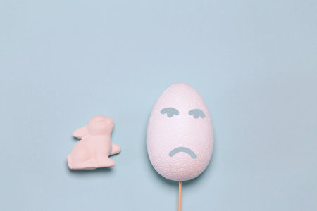 Creative easter composition with decorative white egg and bunny . Minimal style. Abstract background