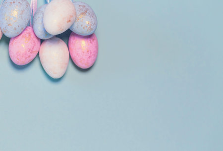 Decorative easter eggs on colorful pastel background. Holiday backdrop for seasonal cards, blogs and web design. Minimal styleの写真素材