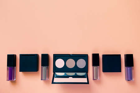 Set of decorative cosmetics on colorful pastel background. Minimal style composition. Top view. Flat layの写真素材