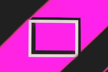 White frame on yellow background with shadows. Creative layout. Top view. Copy space. Flat lay