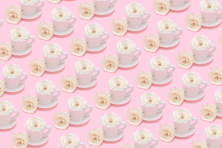 Creative pattern made of white cup of coffee or tea with rose flower buds on pastel pink background. Morning beverage concept. Minimal styleの写真素材