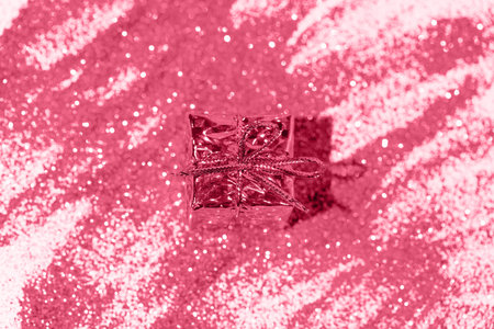 Decorative present box on glittering background. Christmas or birthday gift. Celebration and party concept. flat lay. top view. Color of the year 2023 inspiredの写真素材