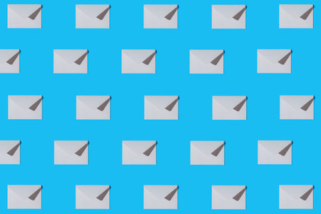 Creative pattern made of white paper envelope on blue background. minimal style. Greeting letter and...