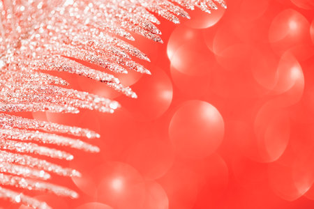 Decorative branch closeup on shiny bokeh background. Abstract holiday backdrop. Celebration and party concept. Copy spaceの写真素材