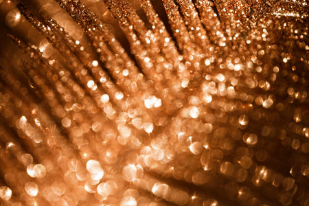 Abstract composition made of a decorative branch closeup. Defocused sparkles. Shiny festive and...