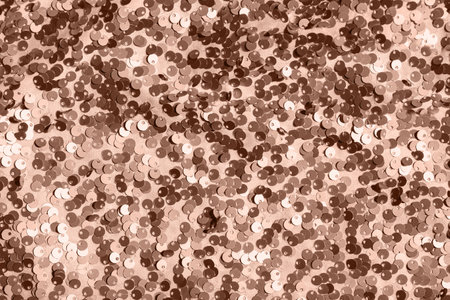 Abstract composition of fabric with shiny sequins. Holiday and party concept. Selective focus. Color of the year 2025 inspiredの写真素材