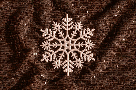 Abstract composition made of snowflake on shimmering background with sequins. Christmas and new year celebration concept. Color of the year 2025 inspiredの写真素材