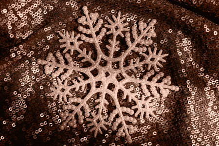 Abstract composition made of snowflake on shimmering background with sequins. Christmas and new year celebration concept. Color of the year 2025 inspiredの写真素材
