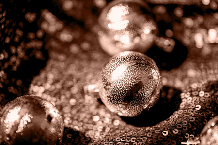 Festive composition made of decorative xmas baubles on shiny background. Christmas and New Year celebration and party concept. Color of the year 2025 inspiredの写真素材