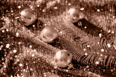 Festive composition made of decorative xmas baubles and leaves on shiny background. Christmas and New Year celebration and party concept. Color of 2025 inspiredの写真素材