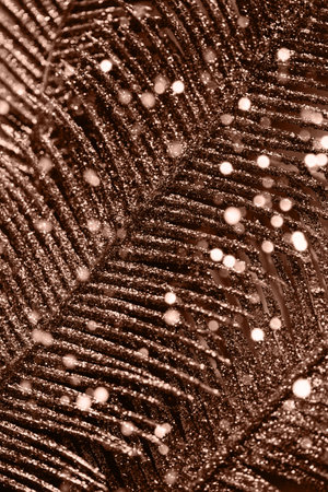 Abstract composition made of a decorative branch closeup. Shiny festive and holiday background. Celebration and party concept. Color of the year 2025 inspiredの写真素材