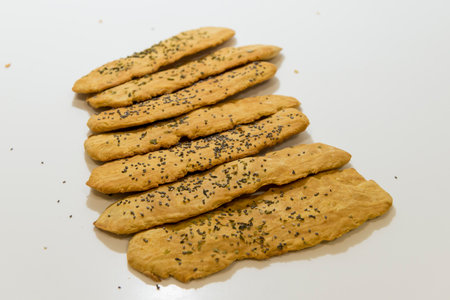 Cookies with sesame seeds on a white background. Select focus.の写真素材