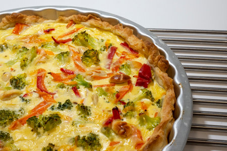 Tasty homemade broccoli quiche on white background, closeup viewの写真素材