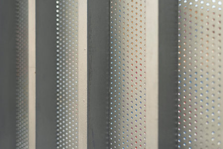 abstract pattern of metal profile with dots and holes, industrial backgroundの写真素材