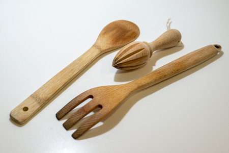 Wooden kitchen utensils on a white background, top viewの写真素材