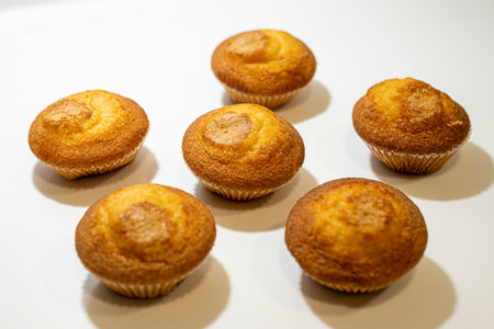 Fresh baked muffins on a white background. Select focus.の写真素材