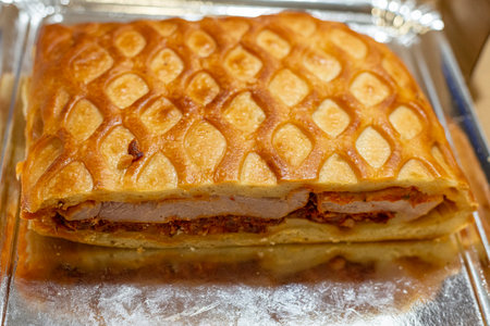 Close-up of apple pie on a baking sheet in a bakeryの写真素材