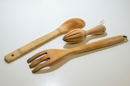 Wooden kitchen utensils isolated on white background. Select focus.の写真素材