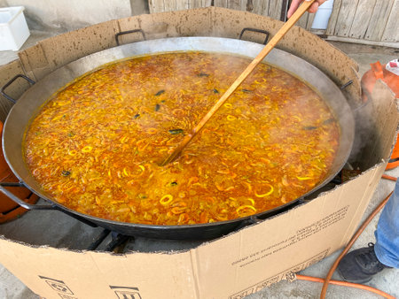 Pilaf in a large cauldron on a street market.の写真素材