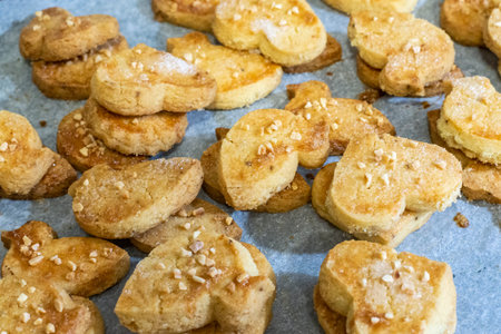cookies with sesame seeds on a baking sheet, close upの写真素材