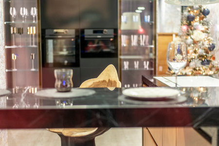 Interior of modern dining room with glass table and black glass doorの写真素材