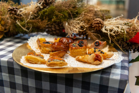 Christmas tartlets on the table in the restaurant, close-upの写真素材