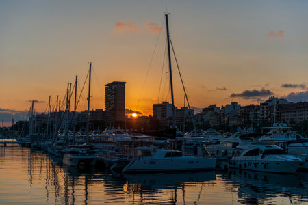 Alicante sunset marina Yachts and boats in the marina at sunset. Tarragona, Catalonia, Spainの写真素材