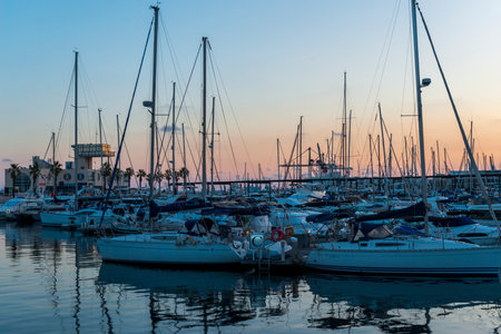 Alicante sunset marina Beautiful marina with yachts and motor boats at sunsetの写真素材