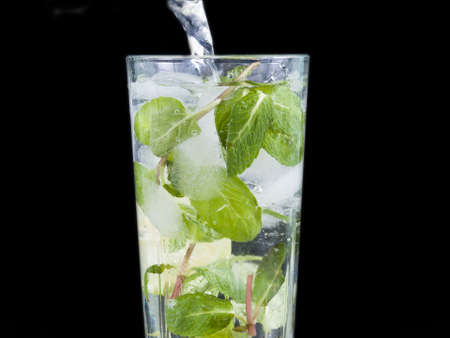 refreshing cocktail with a mint and lemon in glassの写真素材