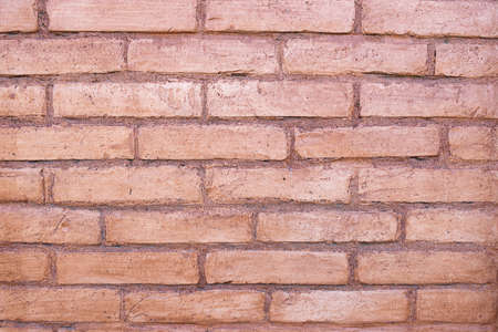 The background of an old brick wall close-up shows every brickの写真素材
