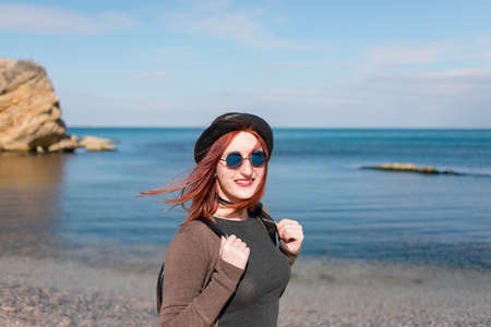 young girl traveller ashore seaの写真素材
