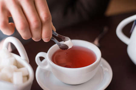 sugar is thrown in teaの写真素材